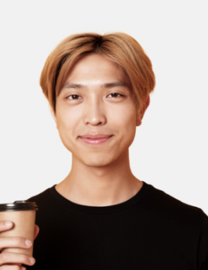 close-up-of-handsome-blond-asian-man-drinking-coff-VL773GE